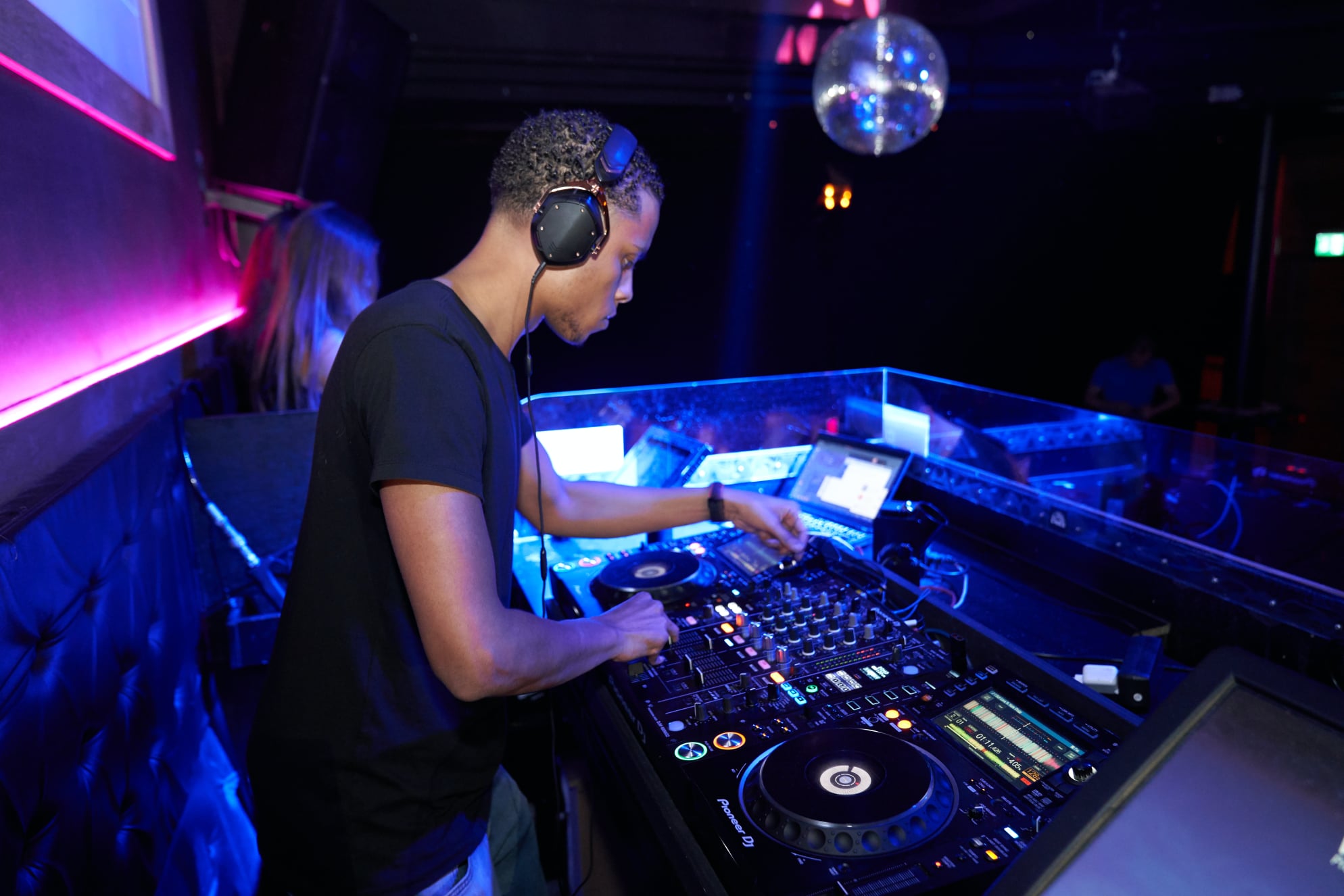 DJ mixing music at a lively party