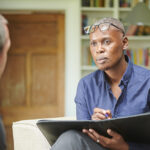 A man in a therapy session in an office